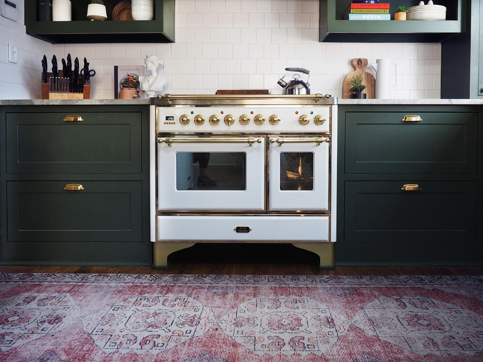 Enclosed kitchen - small contemporary l-shaped dark wood floor enclosed kitchen idea in Dallas with shaker cabinets, green cabinets and white backsplash