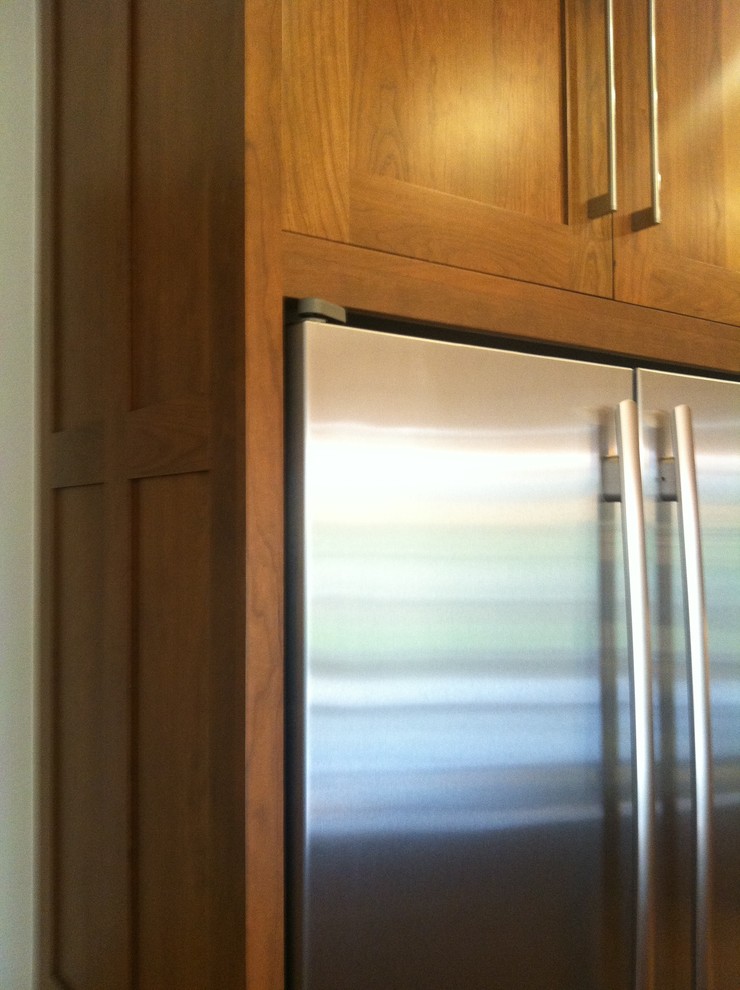 Inspiration for a transitional l-shaped eat-in kitchen remodel in Denver with shaker cabinets, medium tone wood cabinets, granite countertops and stainless steel appliances