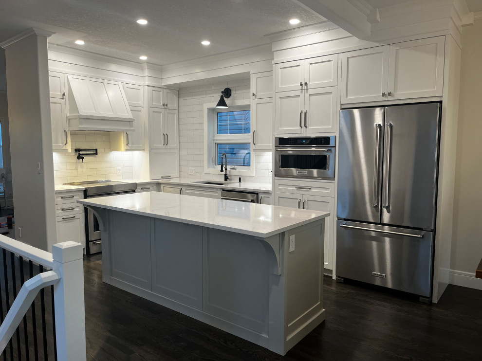 Example of a transitional home design design in Calgary