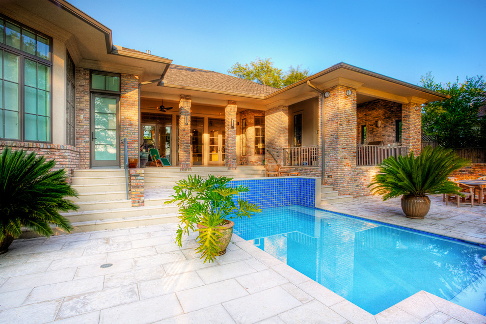 Inspiration for a large backyard tile and rectangular natural pool remodel