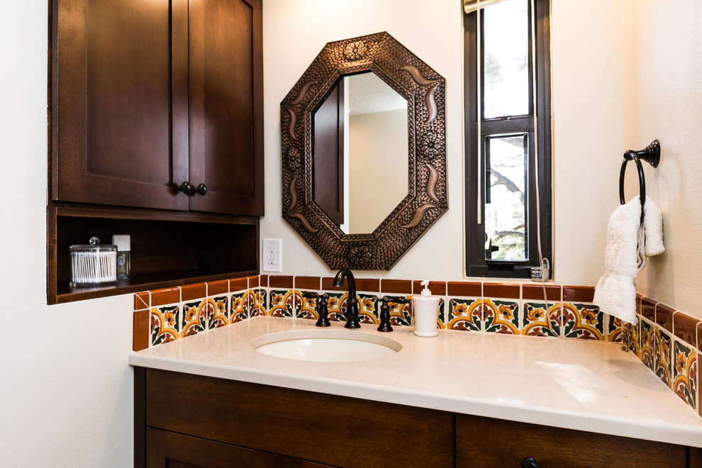 Small master bathroom in Albuquerque with shaker cabinets, dark wood cabinets, multi-coloured tile, ceramic tile, beige walls, ceramic floors, a drop-in sink and engineered quartz benchtops.