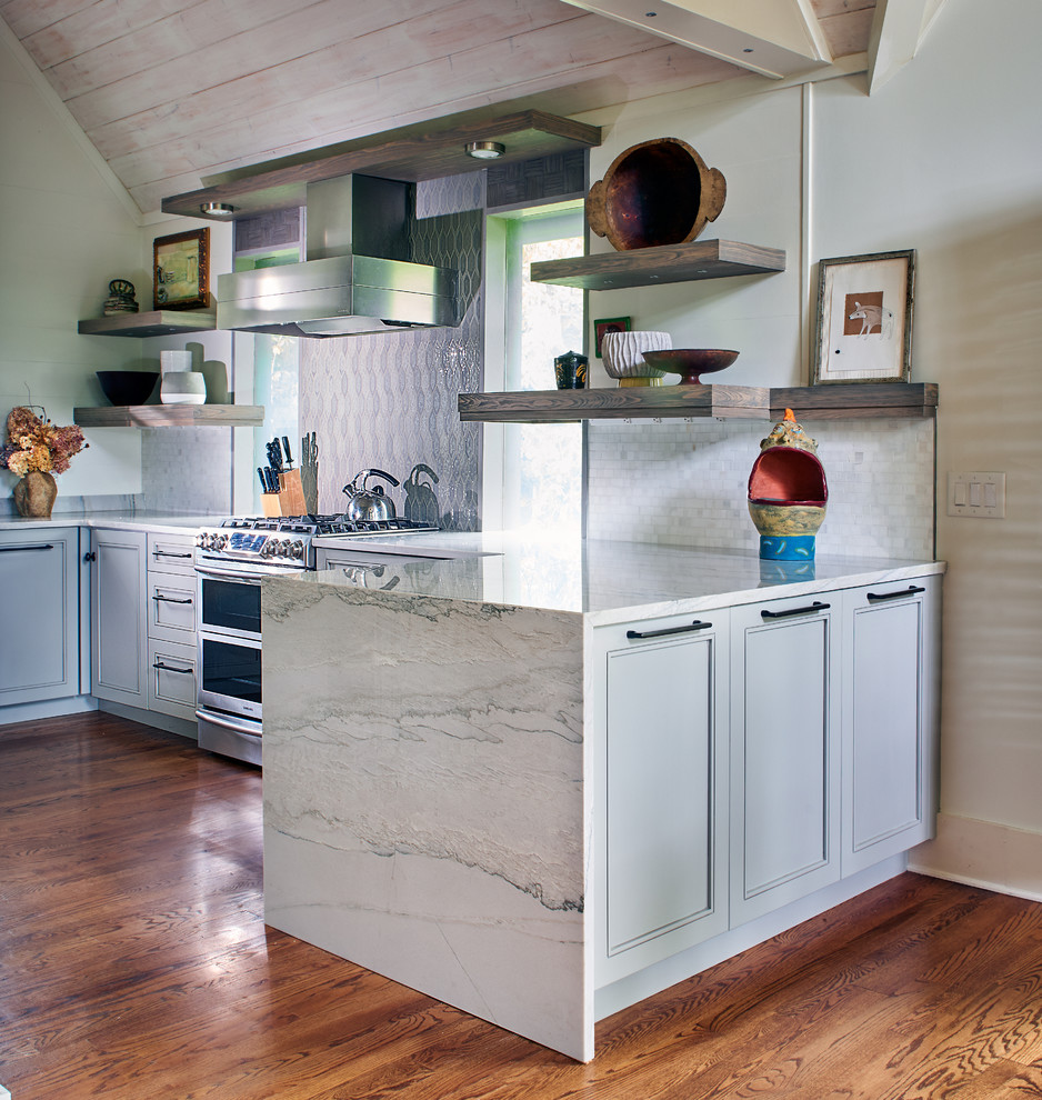 Small transitional single-wall medium tone wood floor, brown floor and vaulted ceiling eat-in kitchen photo with an undermount sink, recessed-panel cabinets, gray cabinets, granite countertops, multicolored backsplash, ceramic backsplash, stainless steel appliances, an island and turquoise countertops