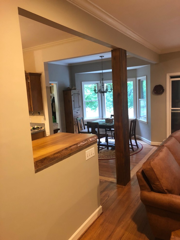 Inspiration for a mid-sized rustic l-shaped home design remodel with wood countertops and brown countertops