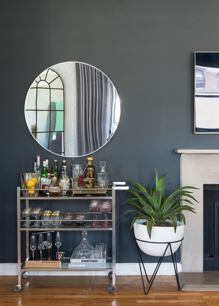 Transitional medium tone wood floor and brown floor bar cart photo in Other