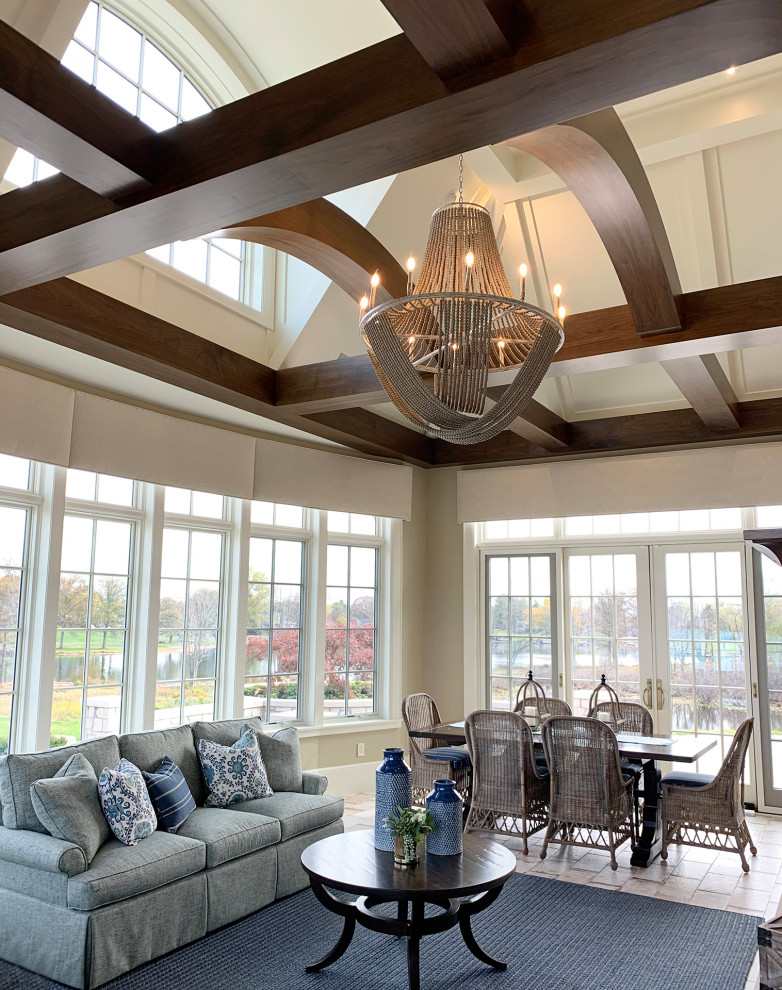 This is an example of a conservatory in Grand Rapids with ceramic flooring, a standard ceiling, beige floors and feature lighting.