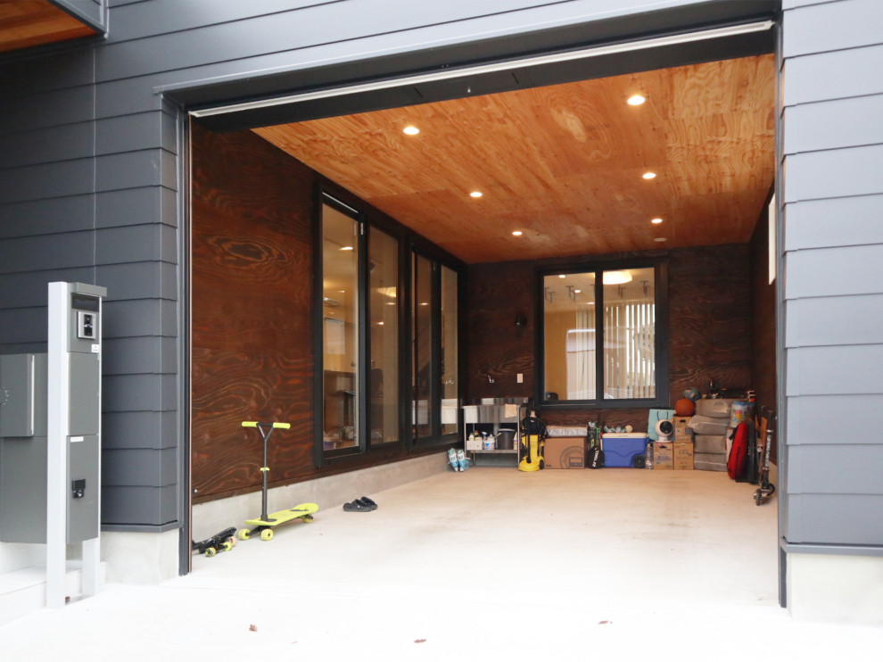 Idee per un garage per un'auto connesso industriale di medie dimensioni con ufficio, studio o laboratorio