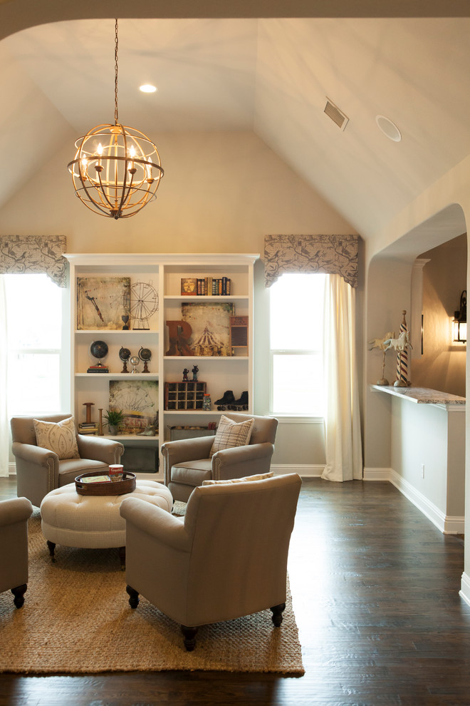Inspiration for a traditional family room in Dallas with beige walls and dark hardwood floors.
