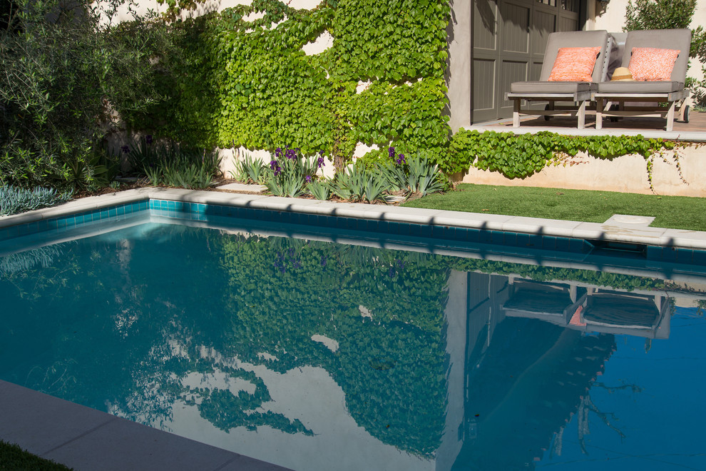Design ideas for a mid-sized mediterranean backyard partial sun formal garden for summer in Los Angeles.