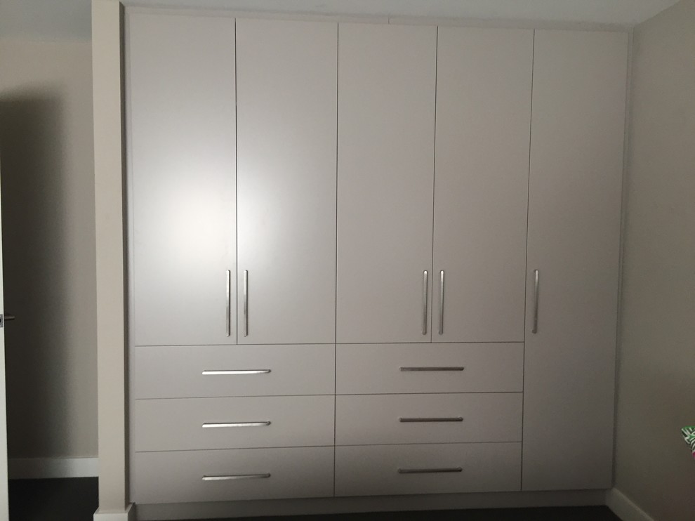 This is an example of a contemporary storage and wardrobe in Sydney.