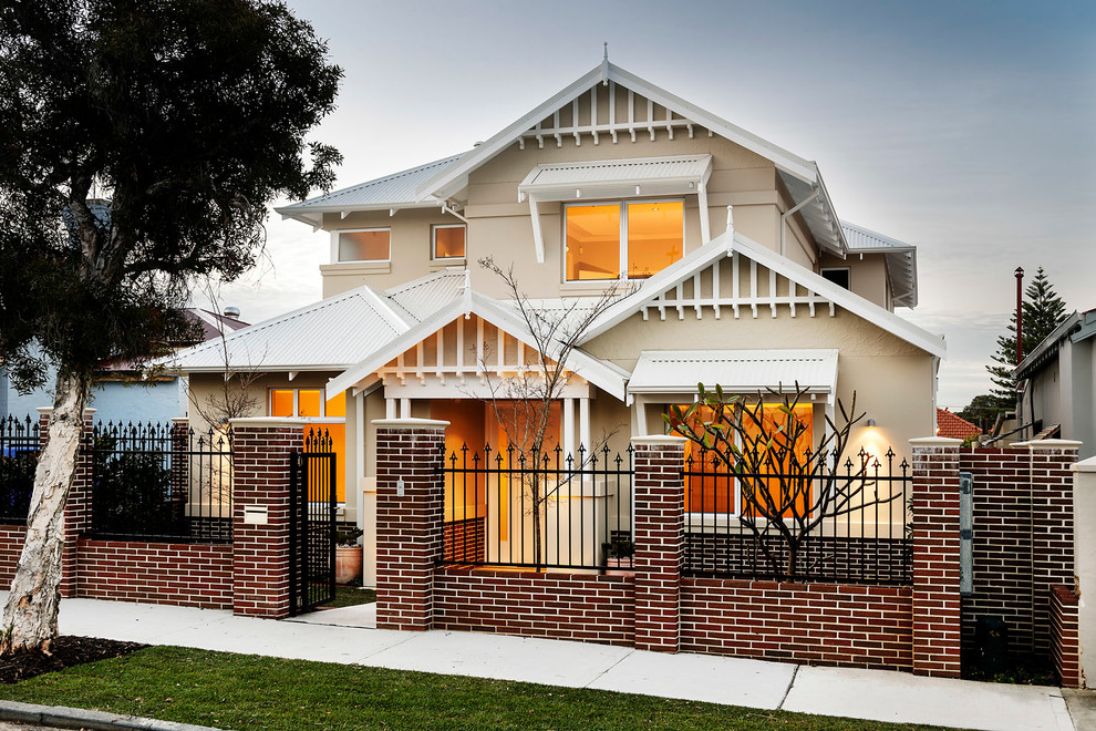 This is an example of a traditional two-storey beige exterior in Perth with a gable roof.