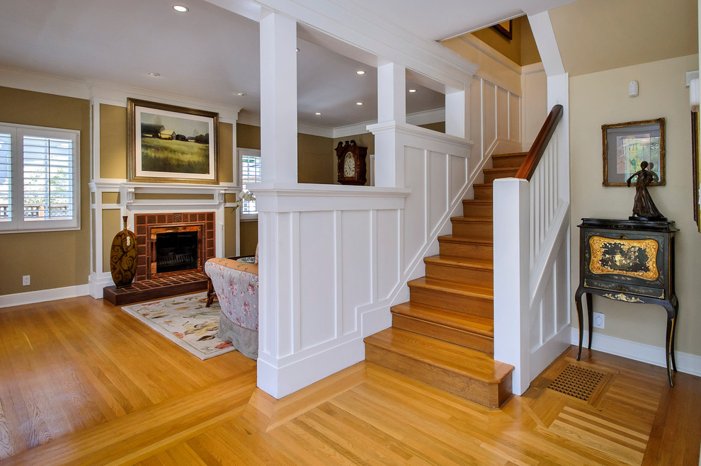 Photo of a traditional wood staircase in San Francisco with wood risers.