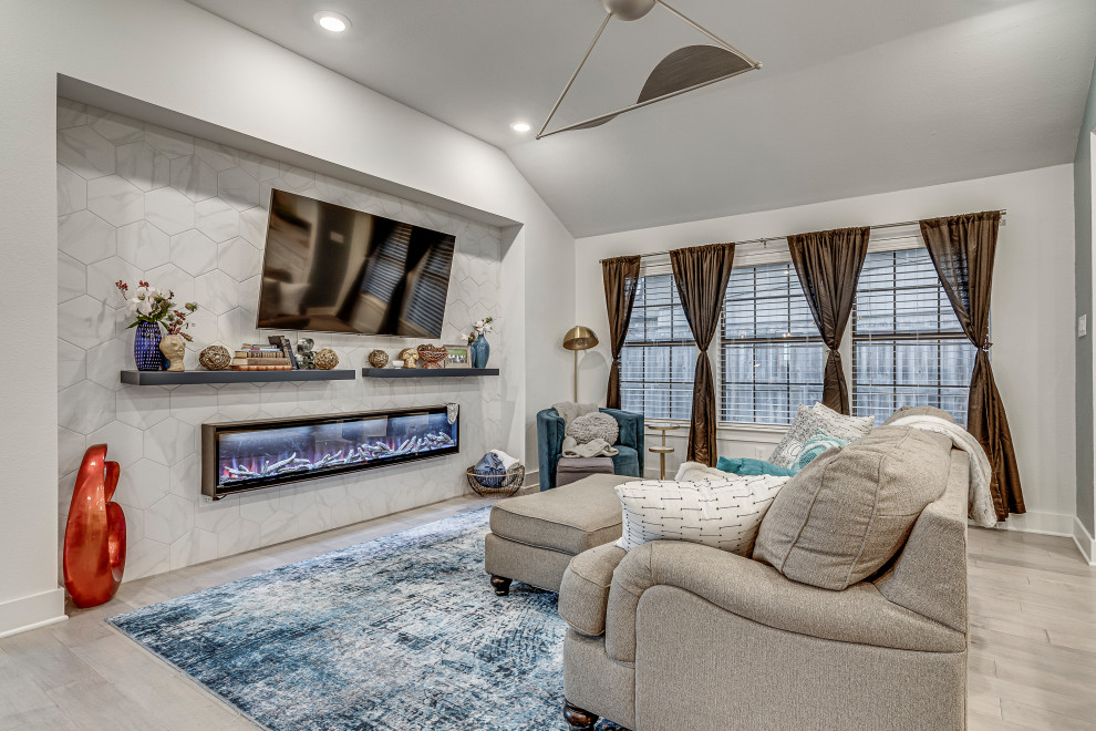 Inspiration for a modern open concept living room in Dallas with grey walls, vinyl floors, a hanging fireplace, a tile fireplace surround, a wall-mounted tv and grey floor.