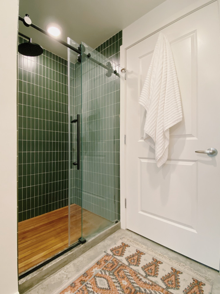 Photo of a medium sized contemporary ensuite bathroom in DC Metro with a walk-in shower, green tiles, ceramic tiles, green walls, a sliding door, a single sink and a floating vanity unit.