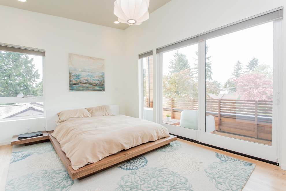 Trendy master light wood floor bedroom photo in Seattle