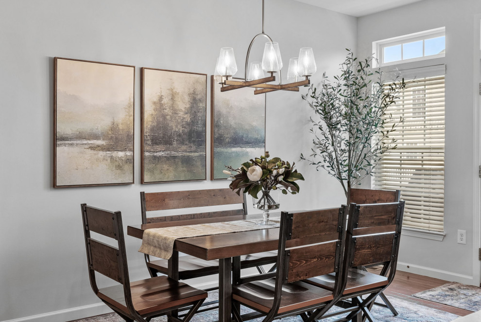 Example of a transitional dark wood floor eat-in kitchen design with a double-bowl sink, gray cabinets, quartz countertops, stainless steel appliances, an island and white countertops