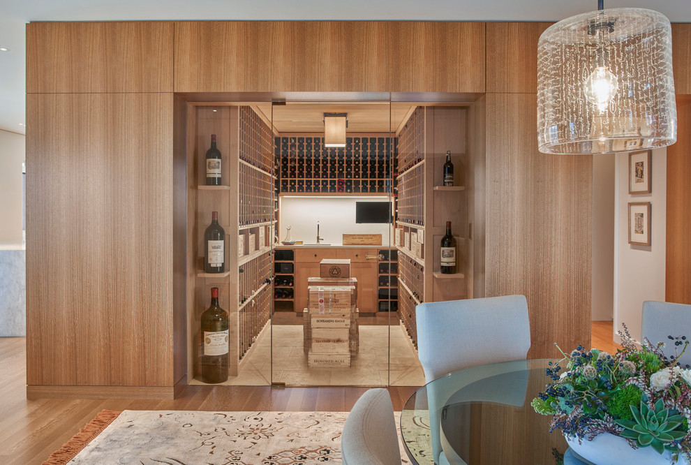 Design ideas for a contemporary wine cellar in Chicago with storage racks and beige floor.