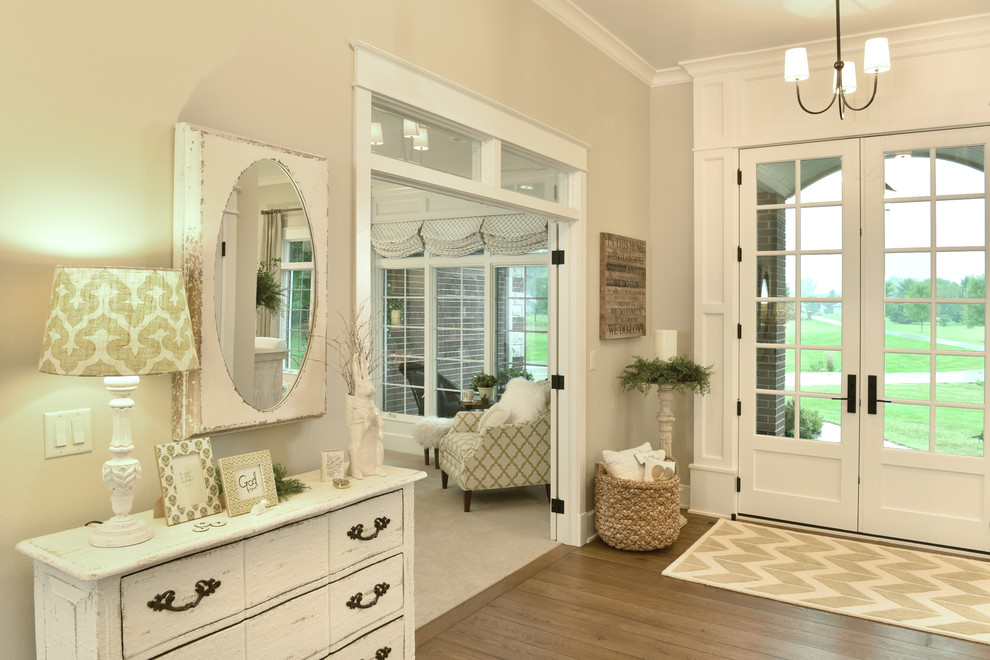 Inspiration for a country foyer in Other with white walls, light hardwood floors, a double front door and a white front door.