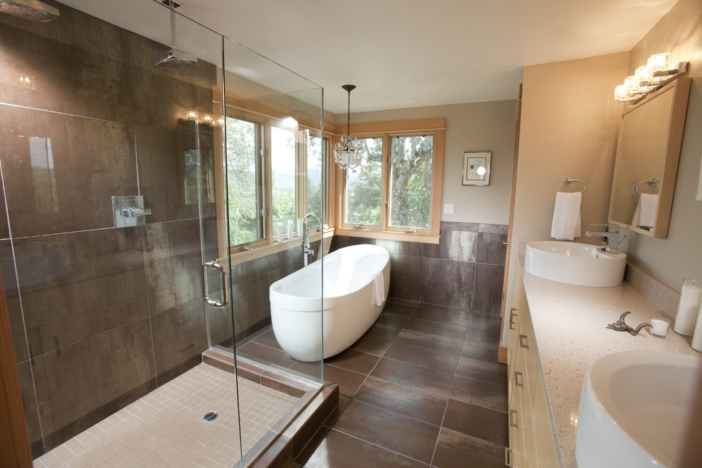 This is an example of a contemporary bathroom in Portland with a freestanding tub and a vessel sink.