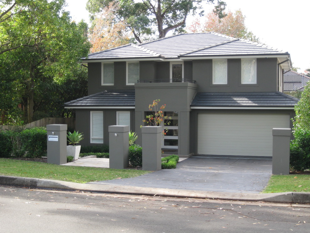 Inspiration for a mid-sized transitional two-storey grey exterior in Sydney with a hip roof.
