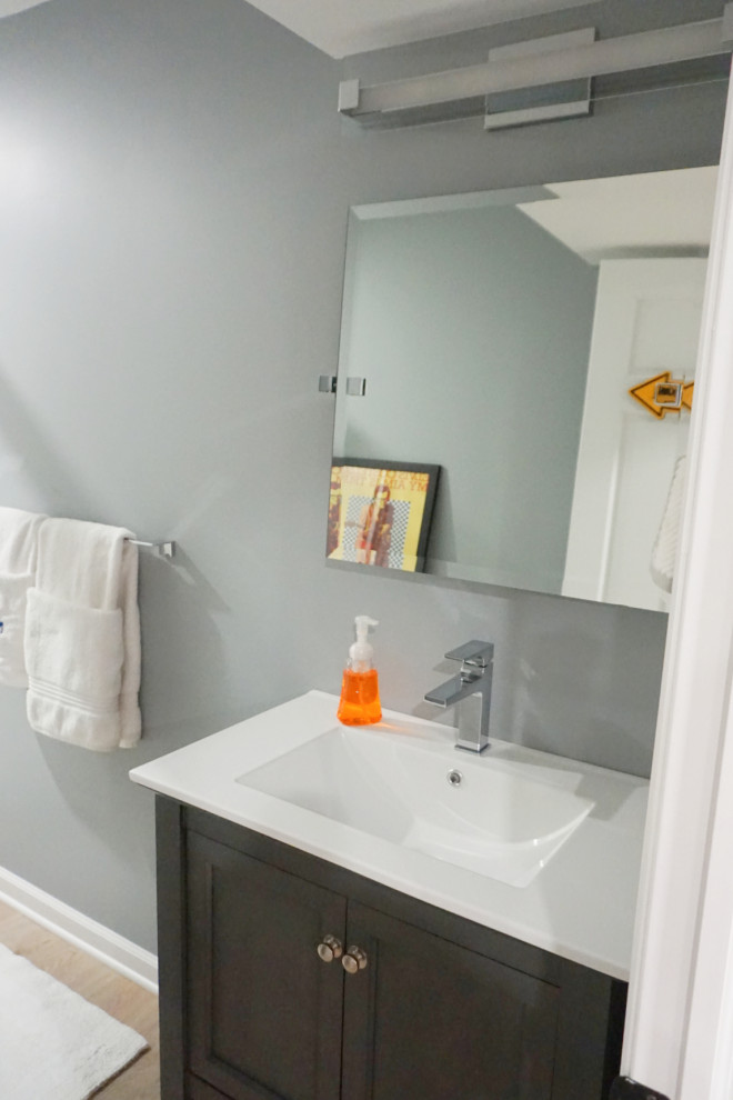Transitional vinyl floor basement photo