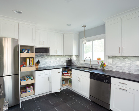 Large transitional l-shaped medium tone wood floor open concept kitchen photo in Chicago with an undermount sink, shaker cabinets, white cabinets, granite countertops, multicolored backsplash, ceramic backsplash, stainless steel appliances and no island