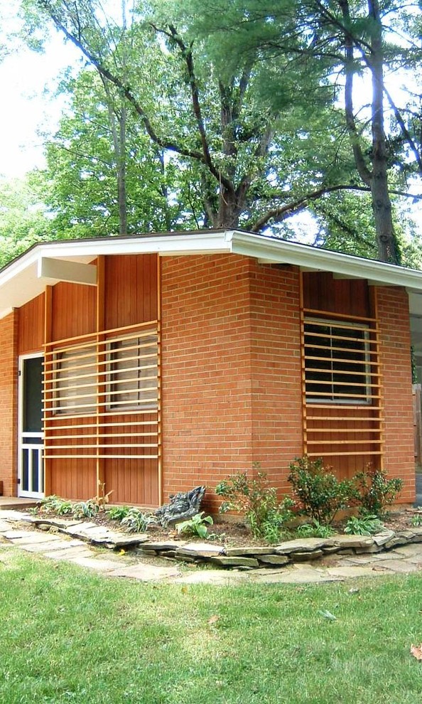 This is an example of a midcentury exterior in Other.