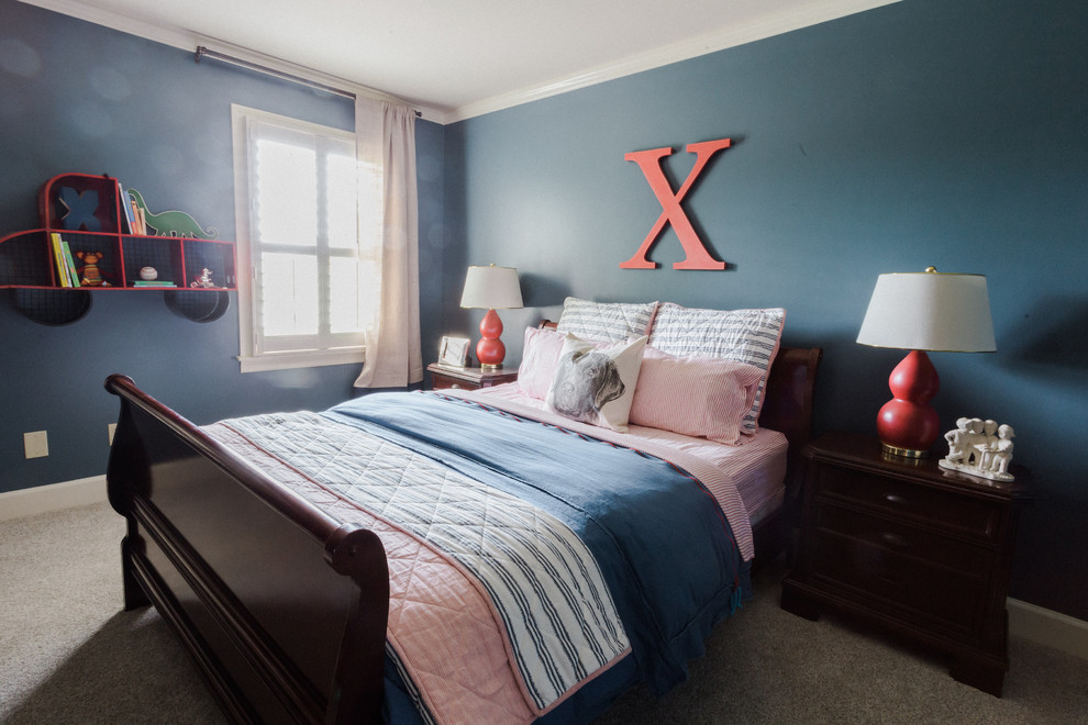 This is an example of a mid-sized traditional kids' bedroom for kids 4-10 years old and boys in Nashville with blue walls, medium hardwood floors and brown floor.