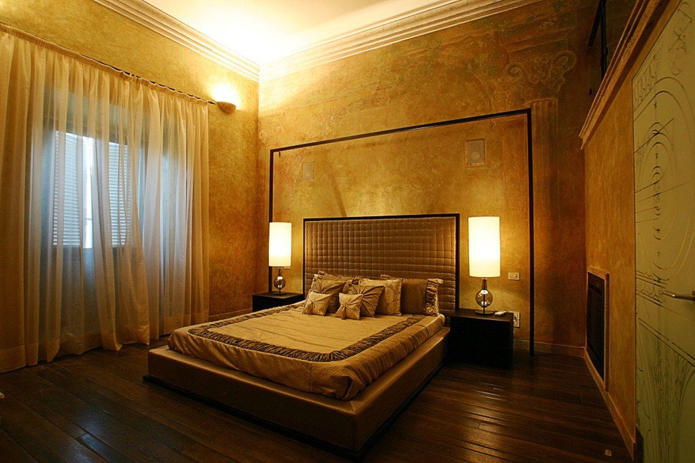 Design ideas for a large eclectic master bedroom in Rome with beige walls and dark hardwood floors.