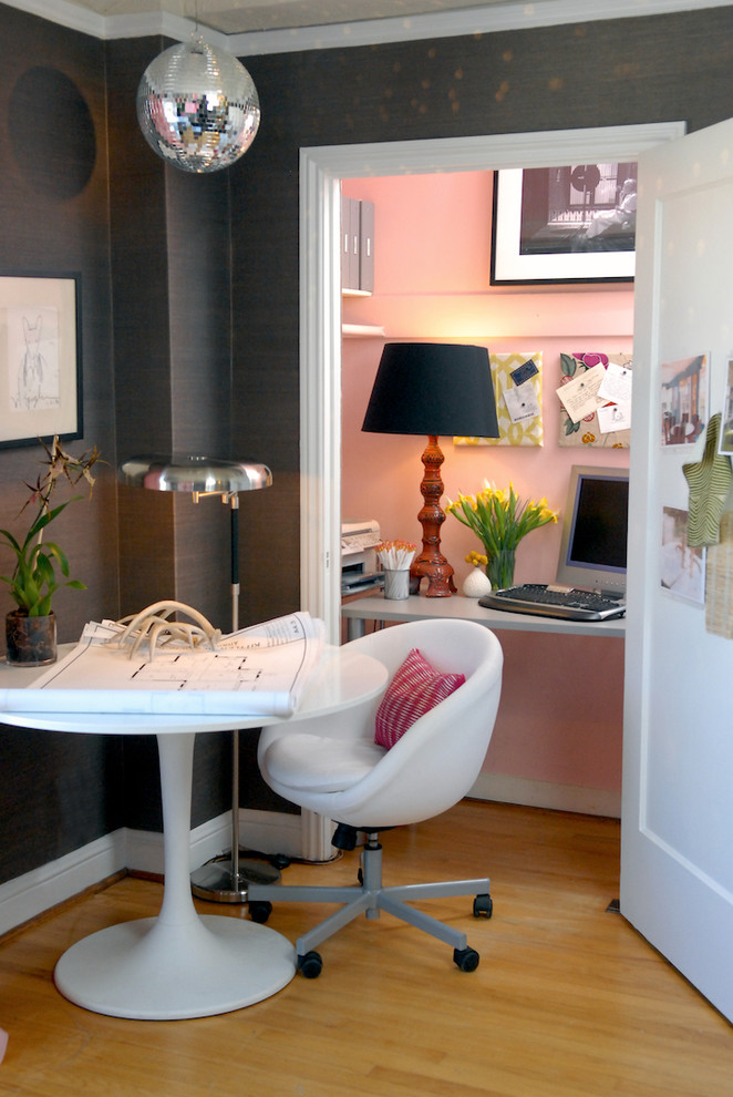 This is an example of an eclectic home office in San Francisco with pink walls.