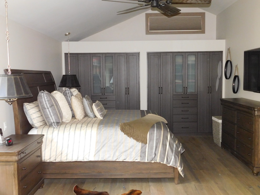 Design ideas for a mid-sized country master bedroom in Burlington with medium hardwood floors.