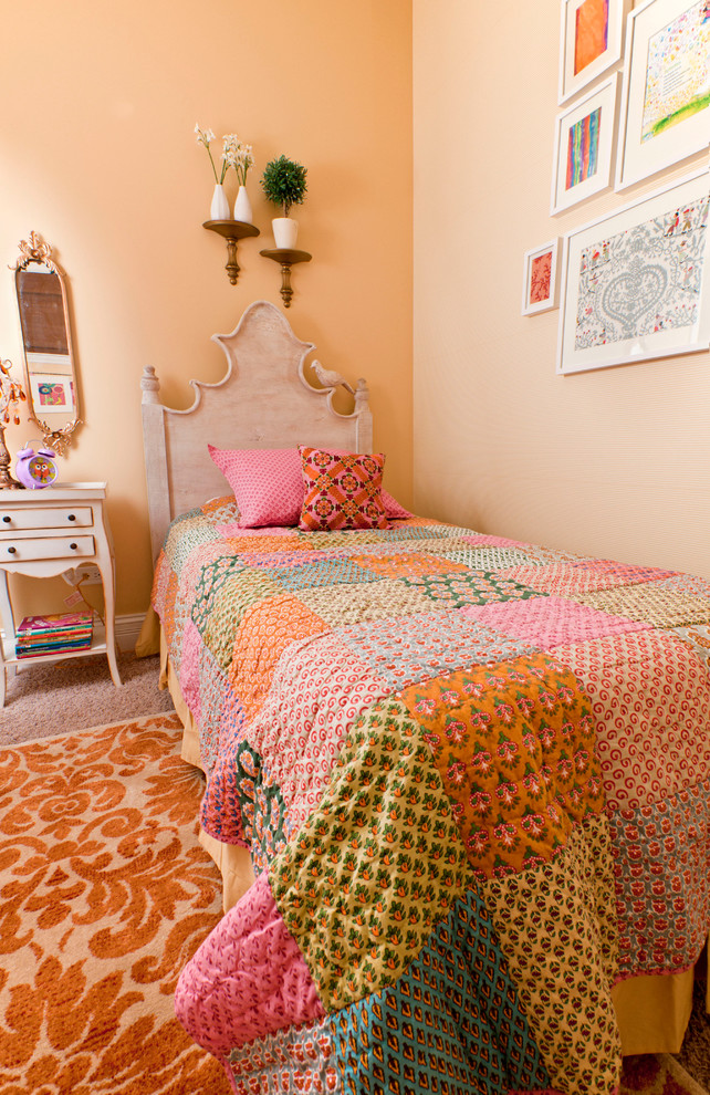 This is an example of a small mediterranean kids' bedroom for kids 4-10 years old and girls in Chicago with carpet and orange walls.