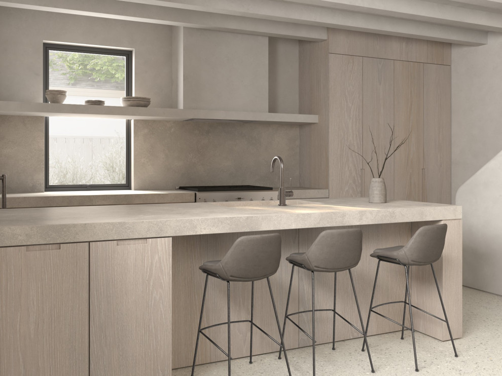 Idéer för mellanstora nordiska grått kök, med en integrerad diskho, släta luckor, skåp i ljust trä, bänkskiva i betong, grått stänkskydd, stänkskydd i sten, rostfria vitvaror, betonggolv, en halv köksö och grått golv