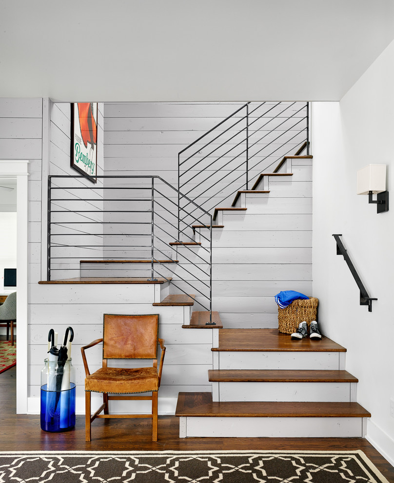 Staircase - country wooden u-shaped staircase idea in Austin with painted risers