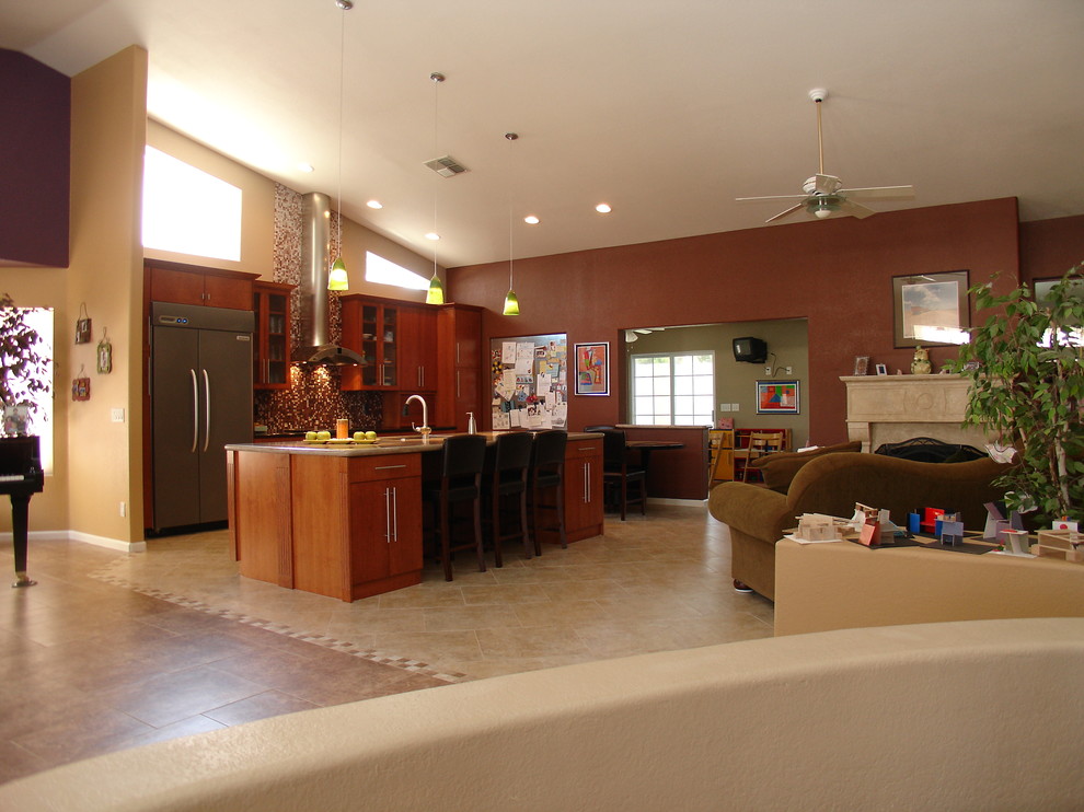 Example of a large transitional single-wall porcelain tile open concept kitchen design in Phoenix with a double-bowl sink, flat-panel cabinets, red cabinets, granite countertops, multicolored backsplash, ceramic backsplash, stainless steel appliances and an island