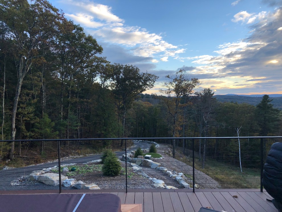 Deck - large rustic side yard deck idea in Boston with no cover