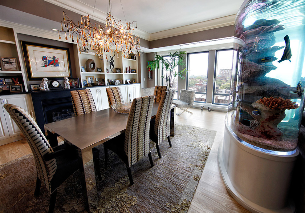 Enclosed dining room - large transitional medium tone wood floor and brown floor enclosed dining room idea with brown walls and a standard fireplace