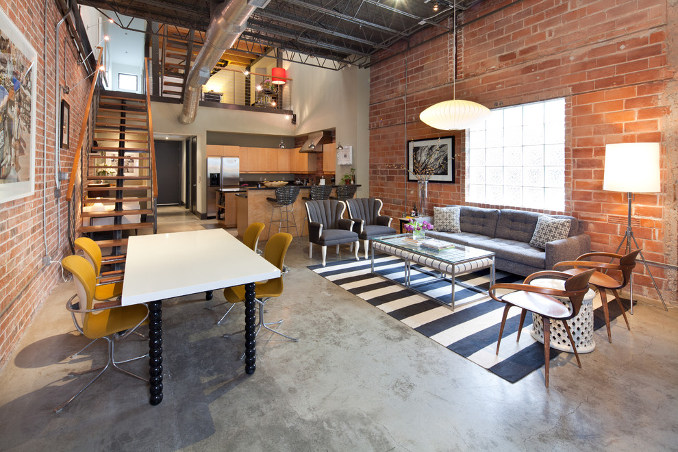 Inspiration for an industrial open concept living room in Houston with no fireplace and no tv.