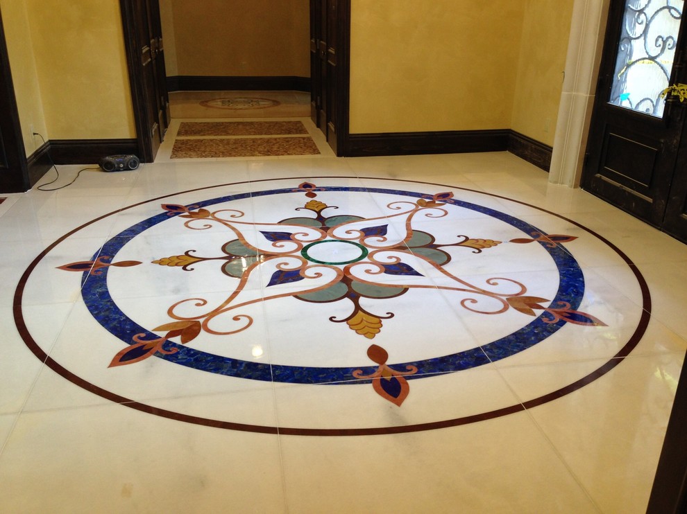 Inspiration for a mediterranean entryway in Houston with porcelain floors.