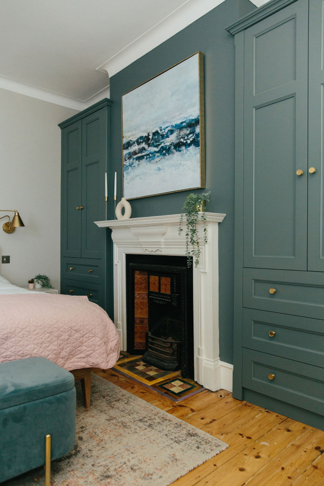 Soft pink and blue master bedroom with recessed storage Traditional Bedroom London by My