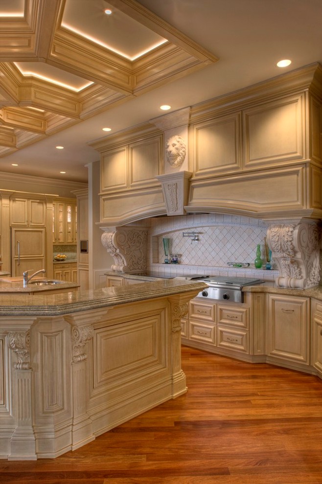 Expansive traditional u-shaped kitchen pantry in Charlotte with an undermount sink, raised-panel cabinets, white cabinets, granite benchtops, panelled appliances and multiple islands.