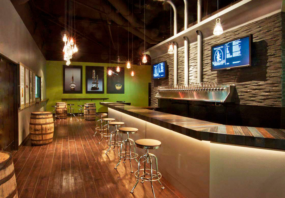 This is an example of an expansive industrial home bar in San Diego.