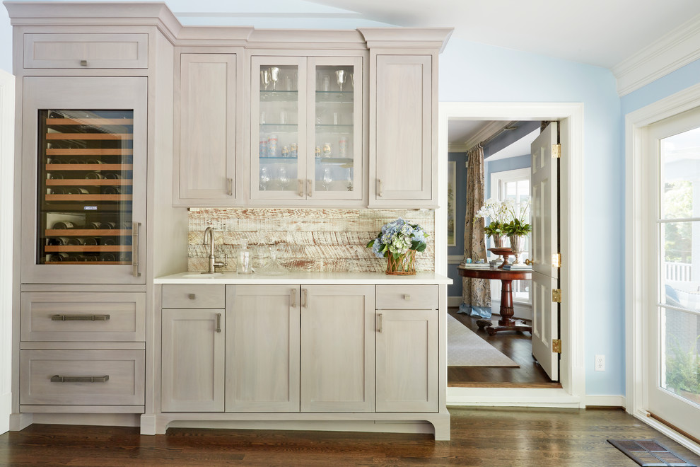 Photo of a traditional single-wall home bar in Richmond with shaker cabinets, light wood cabinets and quartz benchtops.