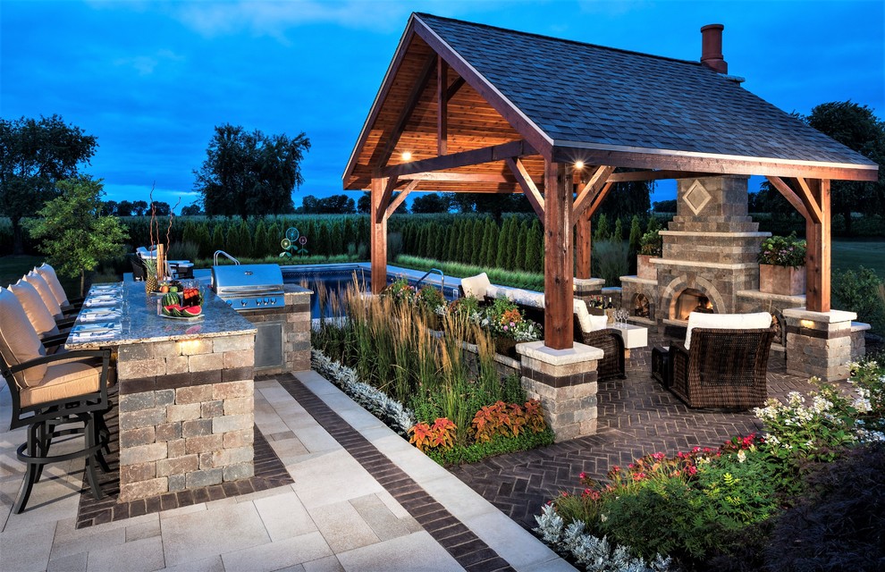 Mid-sized elegant backyard brick partial sun patio photo for summer in Chicago with a gazebo