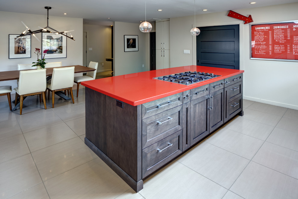 Design ideas for a large contemporary l-shaped eat-in kitchen in San Francisco with an undermount sink, recessed-panel cabinets, dark wood cabinets, quartz benchtops, stainless steel appliances, porcelain floors, with island, beige floor and red benchtop.