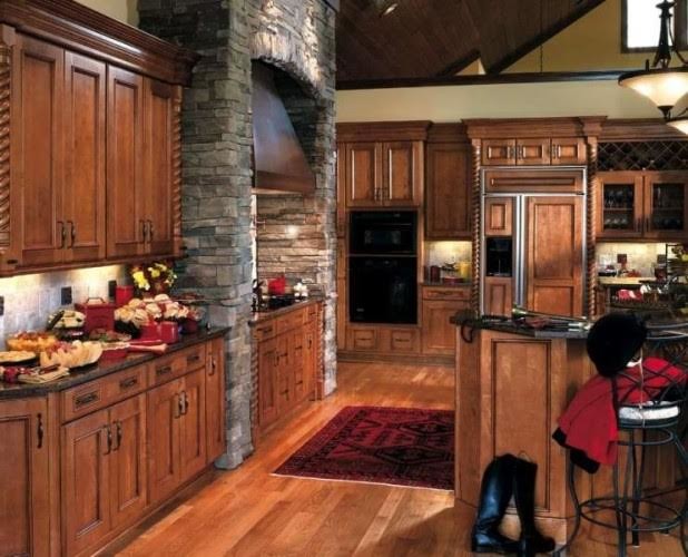 Enclosed kitchen - large rustic medium tone wood floor enclosed kitchen idea in DC Metro with an undermount sink, recessed-panel cabinets, medium tone wood cabinets, granite countertops, gray backsplash, stone tile backsplash, black appliances and an island