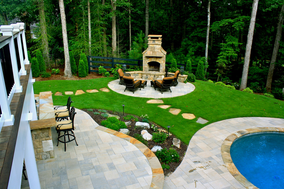 Design ideas for a mid-sized traditional backyard patio in Atlanta with concrete pavers and no cover.