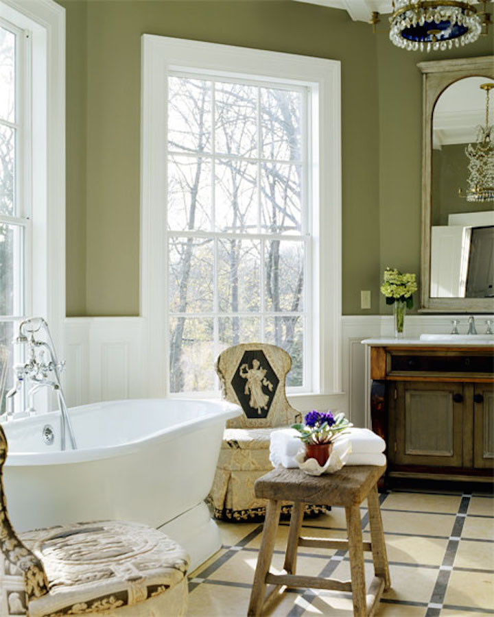 This is an example of a large traditional master bathroom in Boston with furniture-like cabinets, distressed cabinets, a freestanding tub, a shower/bathtub combo, a two-piece toilet, beige tile, green walls, ceramic floors, a drop-in sink and granite benchtops.