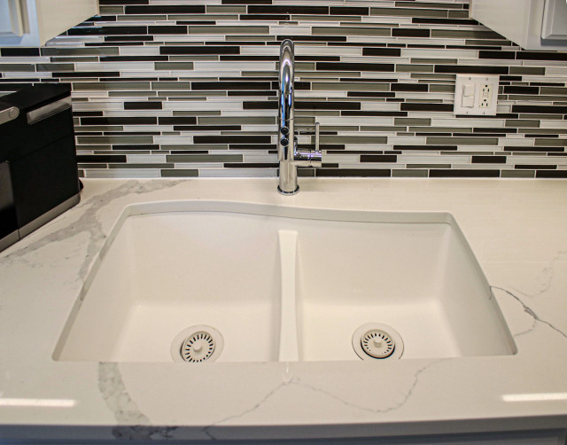 White Kitchen with Quartz Countertop and Mosaic Tile Backsplash ...