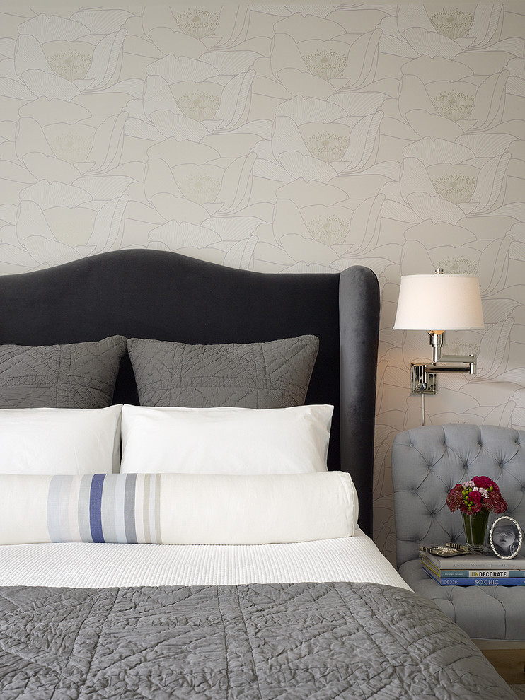 This is an example of a transitional bedroom in San Francisco with beige walls.