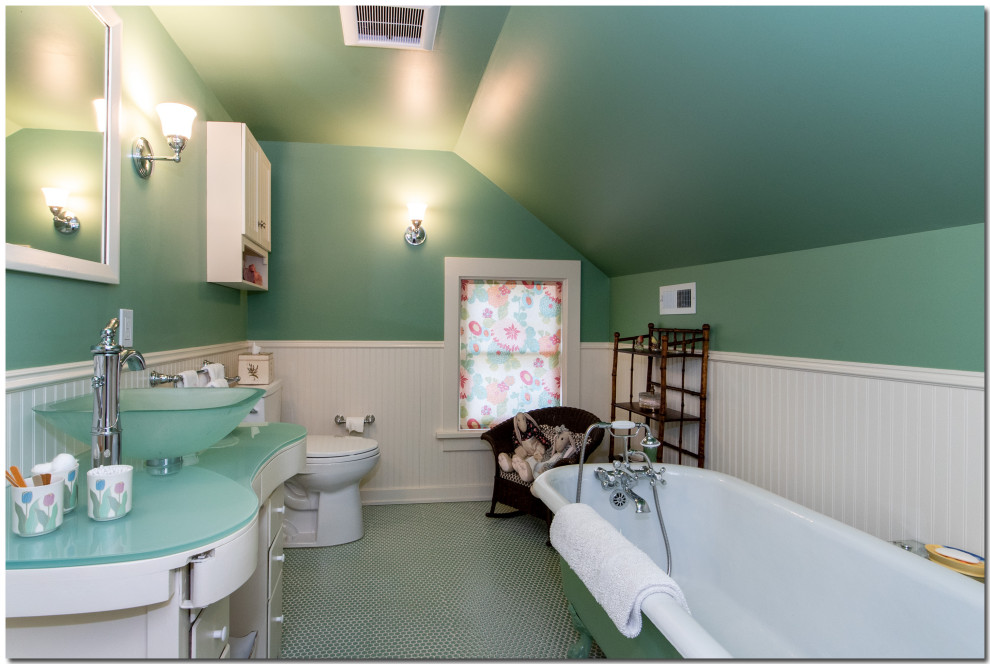 Design ideas for a mid-sized traditional kids bathroom in Cleveland with furniture-like cabinets, white cabinets, a claw-foot tub, a two-piece toilet, green walls, ceramic floors, a vessel sink, recycled glass benchtops, multi-coloured floor and green benchtops.